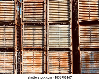 Stack of old cage box palette steel background. Rust on old steel metals