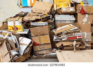 A stack of old cardboard boxes ready for garbage collection.
