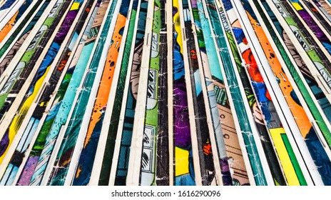 Stack of old comic books creates colorful paper background texture