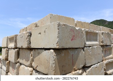 Stack of old concrete blocks against a blue sk - Shutterstock ID 282276743
