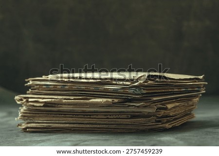 A stack of old letters on the table.Postal envelopes side view.Archival documents.Secret archives on paper.Old recordings.