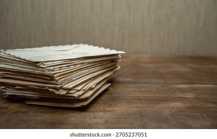A stack of old letters on the table.Write letters.Send a mail envelope.