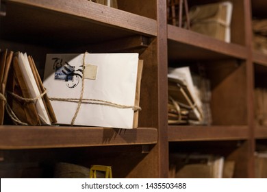 Stack Of Old Letters On A Wooden Bookcase. Old Mail Of The Post Office