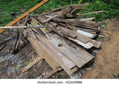stack of old lumber on the floor