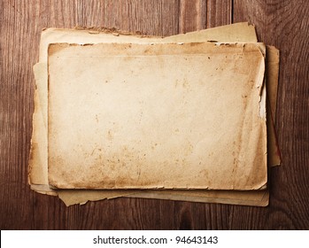 Stack Old Papers On A Wooden Table