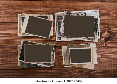 Stack old photos on table. Mock-up blank paper. Postcard rumpled and dirty vintage. Retro card