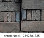 a stack of old red bricks