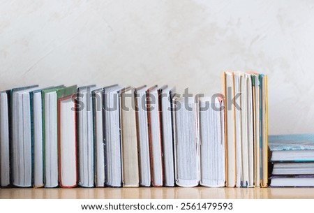 Stack of old and used notebooks. books on the shelf. knowledge. system