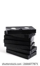 Stack of old VHS videotapes, on white background