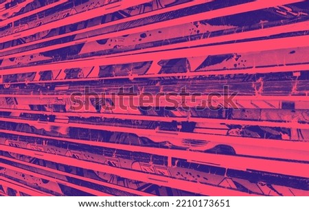 Stack of old vintage comic books creates a colorful background texture with vibrant red and blue duotone effect