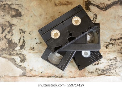 Stack Of Old Vintage Vhs Video Tape On Concrete Background