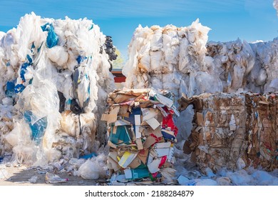 Stack Of Old Waste Paper And Plastic Waste In Front Of Recycling Facility