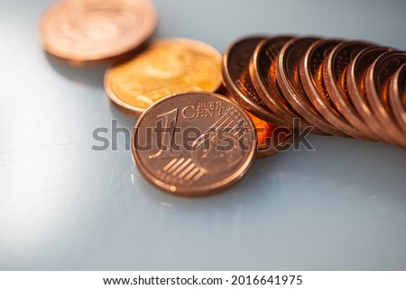 Stack of One Euro Cent Coins Lies on a Gray Background. Web Banner.