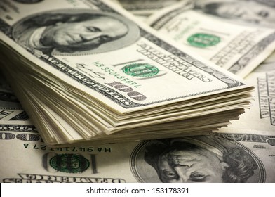 Stack of one hundred dollar bills close-up. - Powered by Shutterstock