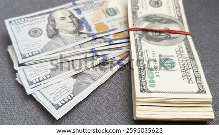 Stack of one hundred dollar bills close-up.