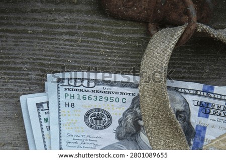 Stack of One Hundred Dollar Bills Hidden Under Old Vintage Wooden Chest