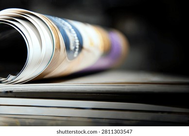 stack of open Curved Book