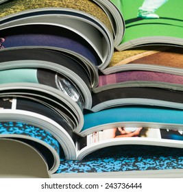 stack of open magazines