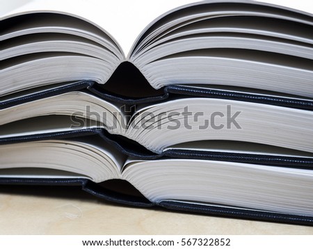 stack opened books on