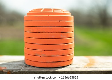 Stack Of Orange Clay Pigeons