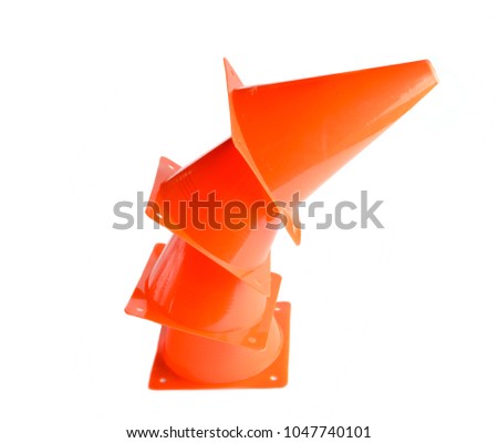 Stack of orange cone, road barrier isolated on a white background.