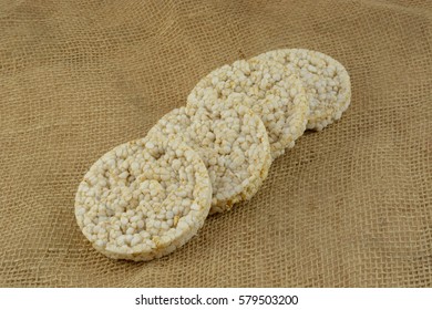 Stack Of Organic Brown Rice Cakes On Burlap