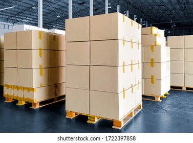 Stack of Package Boxes on Wooden Pallets. Interior of Storage Warehouse. Supply Chain. Cardboard Boxes. Cargo Shipment Export-Import. Shipping Warehouse Logistics.