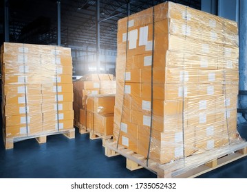 Stack of package boxes wrapping plastic on pallets, Interior of warehouse storage, warehouse industry delivery shipment goods, manufacturing plant shipping logistics and transport
