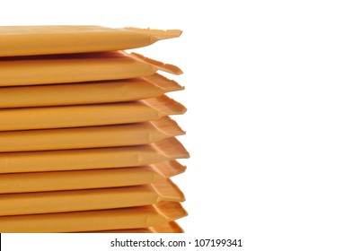 Stack of padded mailing envelopes isolated against a white background