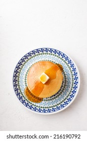 stack of pancakes with butter