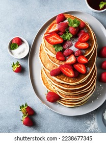 stack of pancakes with fruits