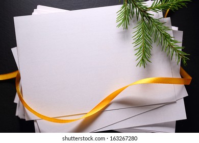 Stack Of Paper Cards And Twig Of Evergreen Fir