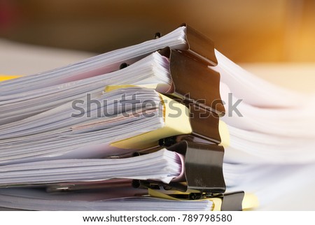 Stack of Paper documents with clip, Pile of unfinished documents on office desk folders. Business papers for Annual Report files, Document is written,presented. Business offices concept.