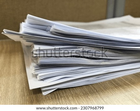Stack of paper documents on office desk, paperwork and administration concept, business files, report sheets pile, workplace organization background