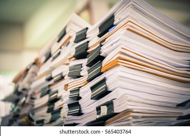 Stack of paper files - Shutterstock ID 565403764