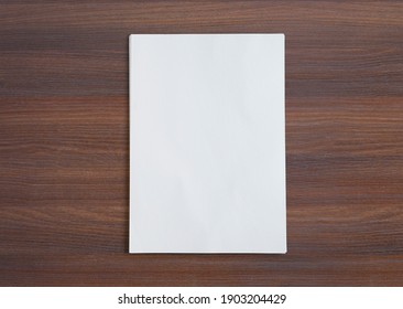 Stack Of Paper Folios On Wooden Desk. High View