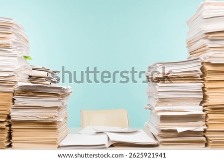Stack of paper on desktop in office. -image
