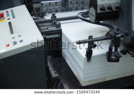 Stack of paper in a printing press. 