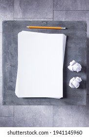 Stack of paper sheet with empty pages on abstract table background. Creative idea concept