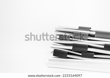 a stack of paper. Working documents with bookmarks on a light background