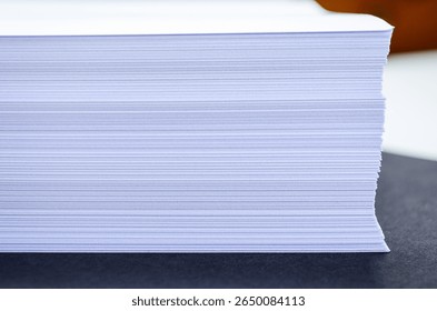 Stack of papers with blurred background, close-up, office documents and workspace