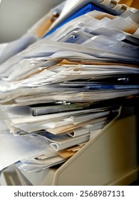 Stack of papers, books, notes, work, office, archive.
