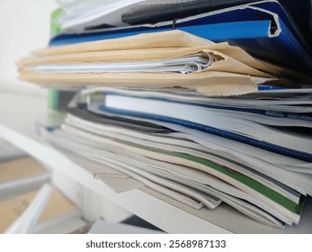 Stack of papers, books, notes, work, office, archive.