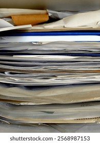 Stack of papers, books, notes, work, office, archive.