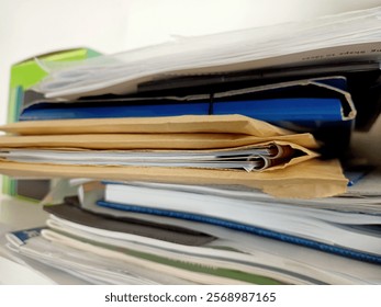 Stack of papers, books, notes, work, office, archive.