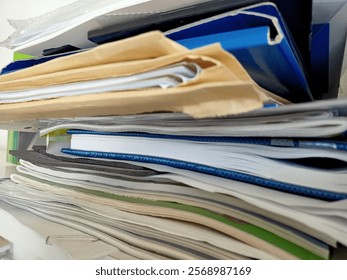 Stack of papers, books, notes, work, office, archive.