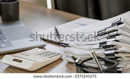 stack of paperwork with unfinished documents achieves