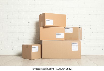 Cardboard Parcel Boxes On Floor Near Stock Photo 1247447113 | Shutterstock