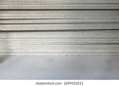 Stack of particleboard sheets in a warehouse copy space