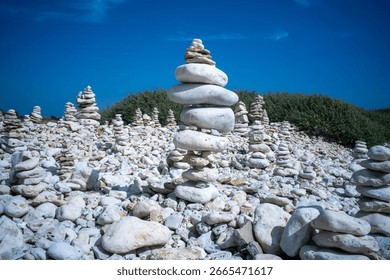 stack of pebbles balanced on the rocky coast of the island of Oléron